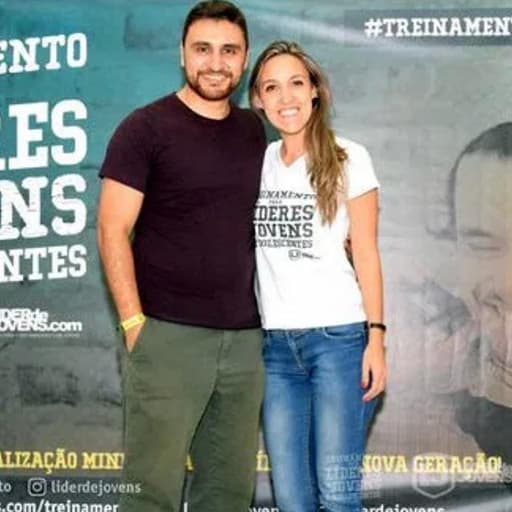 man and woman posing for photo